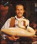 Myself, Rick Heller, at a younger age with a wood swan sculpture.